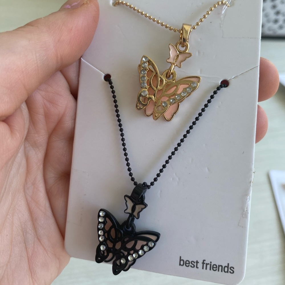 2 BFF Butterfly necklaces.